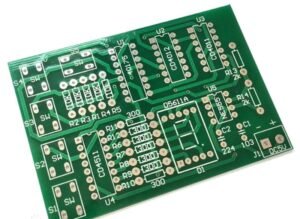 Bare PCB with copper traces, vias, pads, and silkscreen on green FR-4 substrate