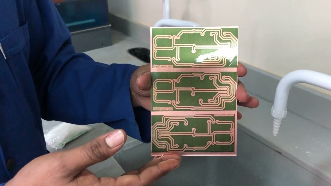 PCB etching process using acid solution to remove unwanted copper while protected areas remain with hardened photoresist