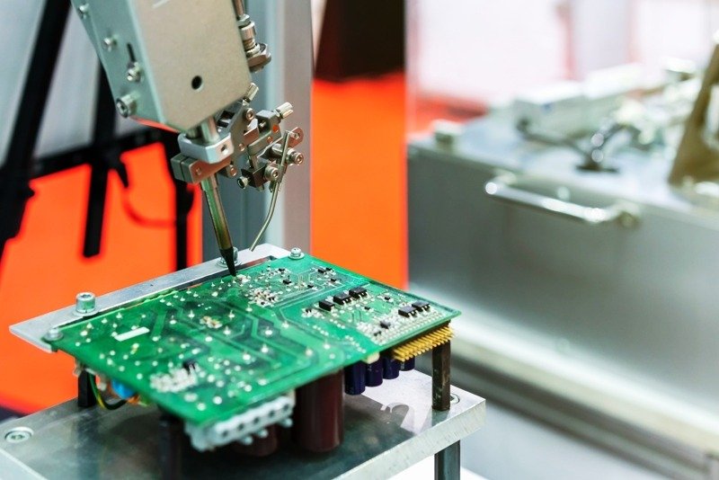 Diagram of Printed Circuit Board Assembly process including SMT assembly, through-hole technology, soldering, and quality inspection procedures